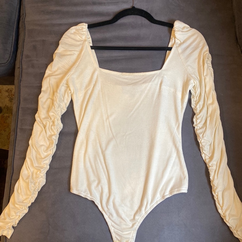 Cream bodysuit ruffled sleeves